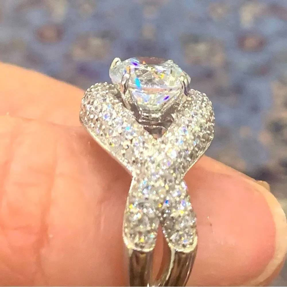 Unique and lovely solitaire style with a wrap effect size 8. CZ and silver